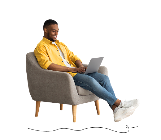 Man sitting on couch on computer